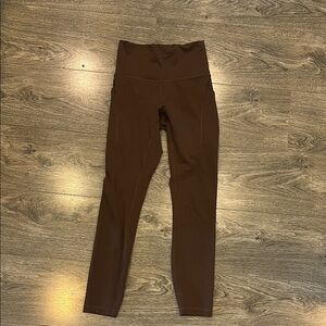 Wunder train high rise tight with pockets 25”